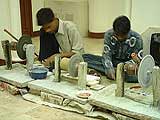 Polishing the pieces of stones to be inlaid, to get shiny look.